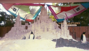 Picture of elaborate sand castle with fake penguins